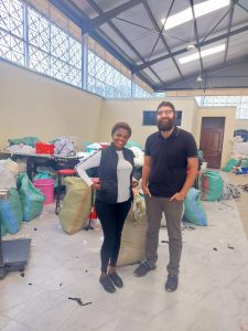 Brian stands with local recyclers Kenya.